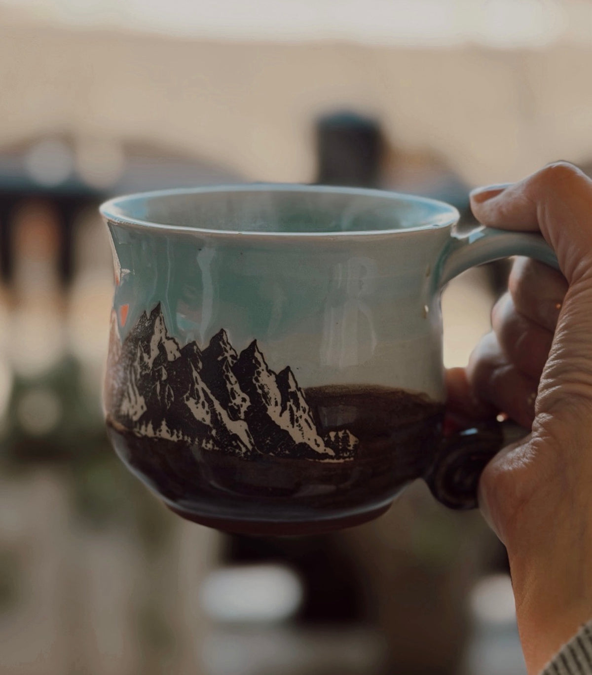 Handmade mug with mountain stencil